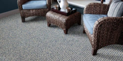 Wool carpet flooring in room with wicker chairs