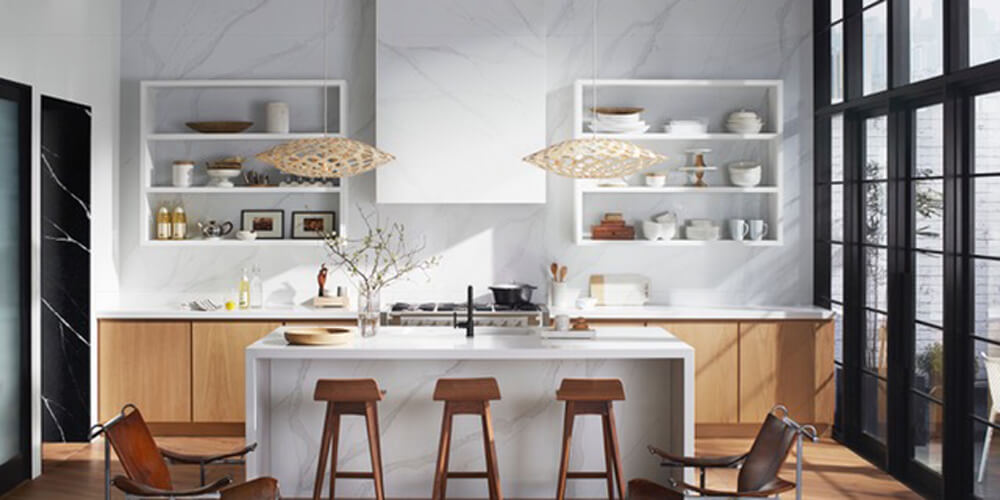 Kitchen with white island white shelves and wooden stools