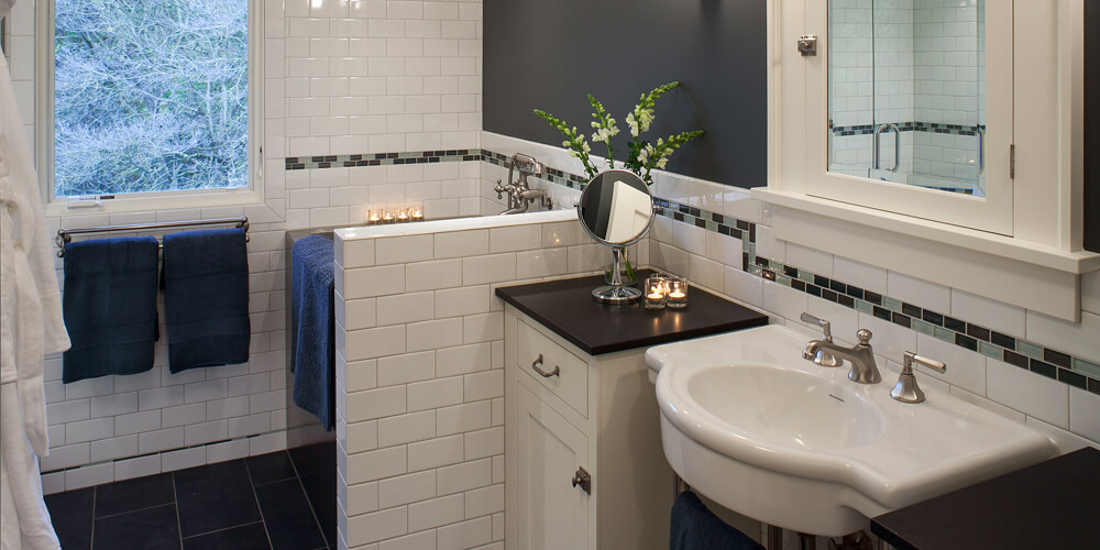 White subway tile and countertops in updated bathroom