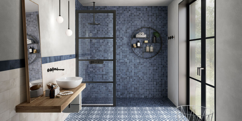 Blue tile floors and shower in bathroom