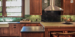 Updated green kitchen tile backsplash and new granite countertops