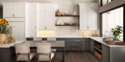 Sleek modern kitchen renovation with new tile backsplash, countertops, and flooring