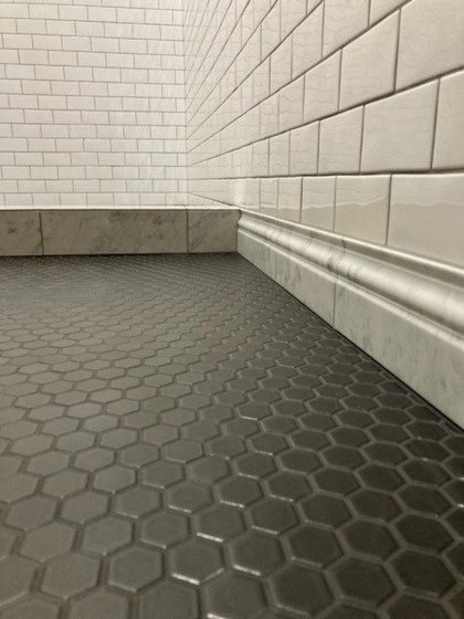 tile bathroom with hex floor marble