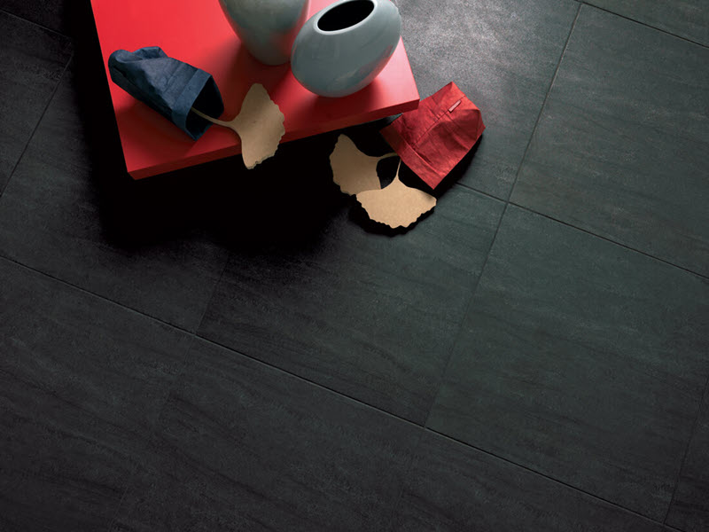 Large format square makes a strong statement as a dark slate-inspired floor tile. Here is a 24" square tile installation.