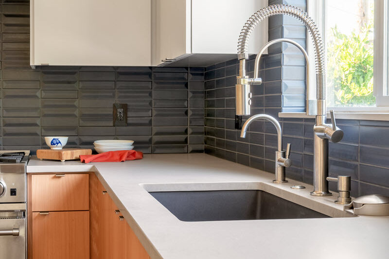 Counters and backsplash come together in this kitchen installation with Classique