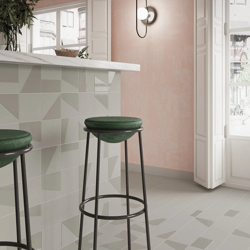 Subtle texture in square tiles enhances the surface without overwhelming the space.