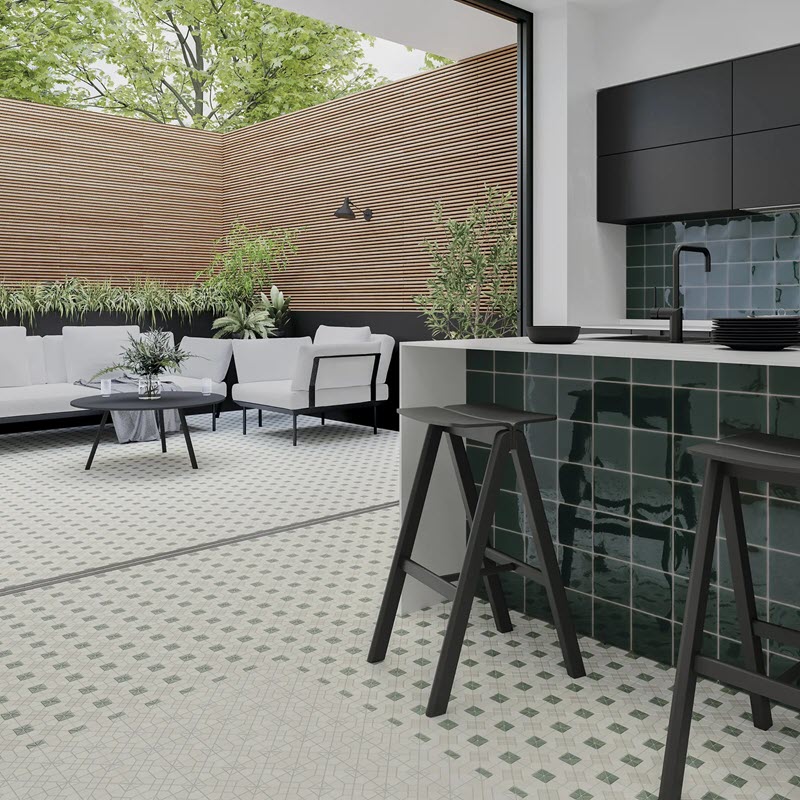 A glossy wall tile contrasts beautifully with solid floor tiles to create a cohesive look.