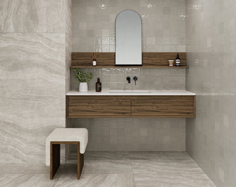 See how large format square tiles showcase natural stone textures for a dramatic floor installation.