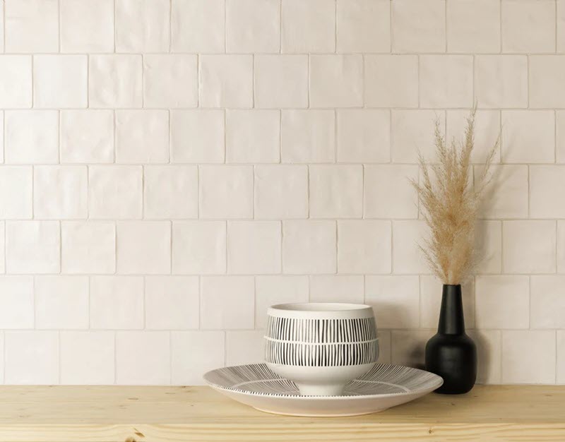 The undulating surface of Zellige tile captures light beautifully, creating a warm, inviting ambiance.